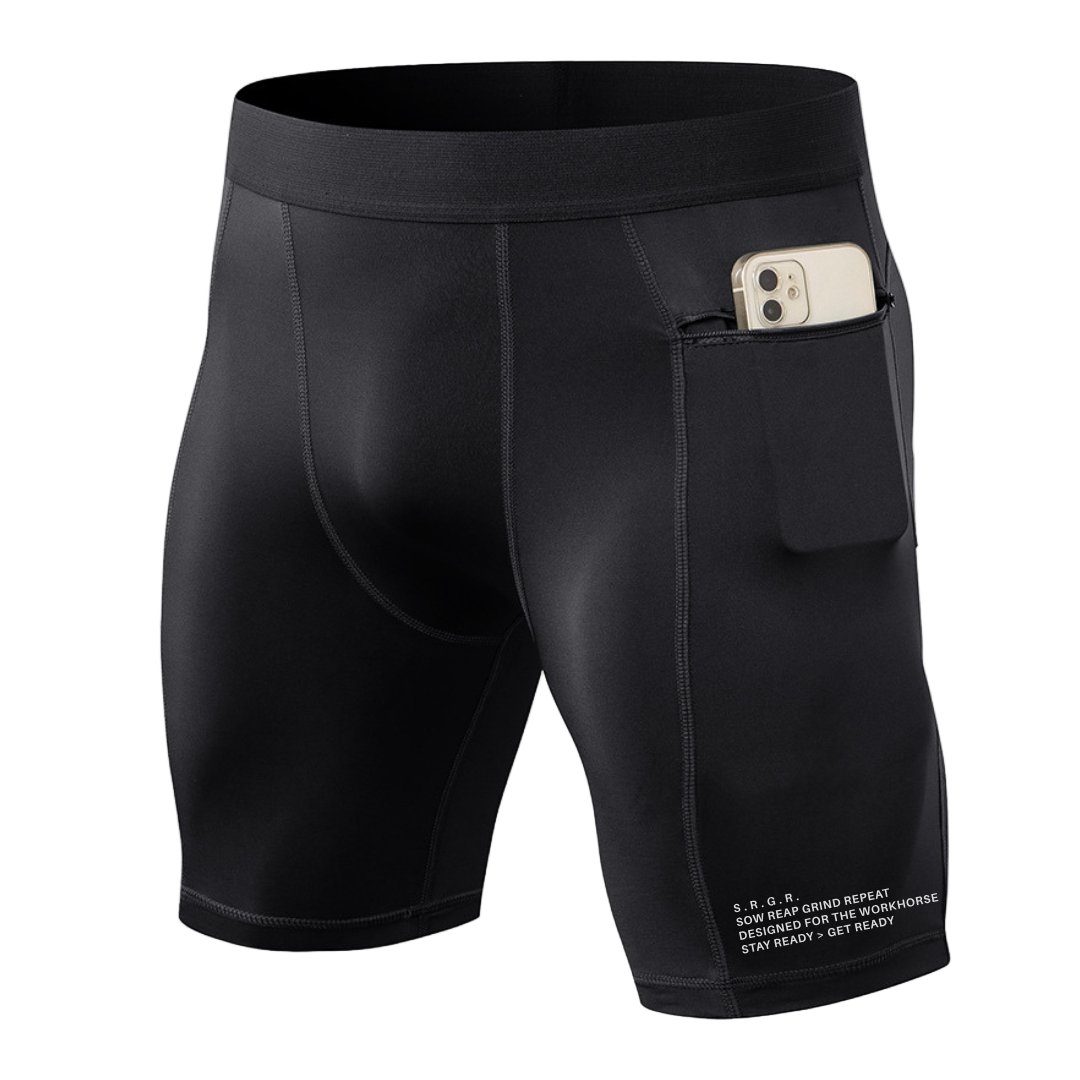 Black athletic shorts with a pocket holding a phone on a white background