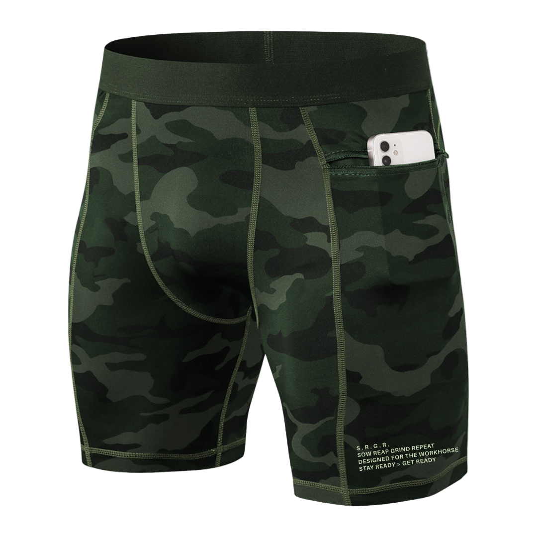 Camouflage shorts with a pocket holding a phone on a white background