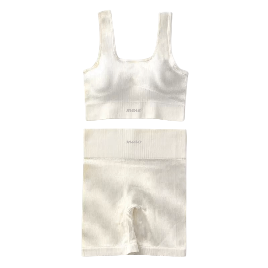 White ribbed tank top and shorts set on a white background