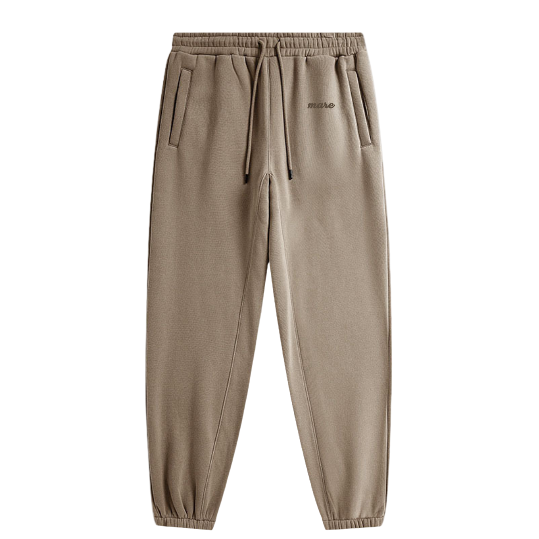 Brown sweatpants with a brand logo on a white background