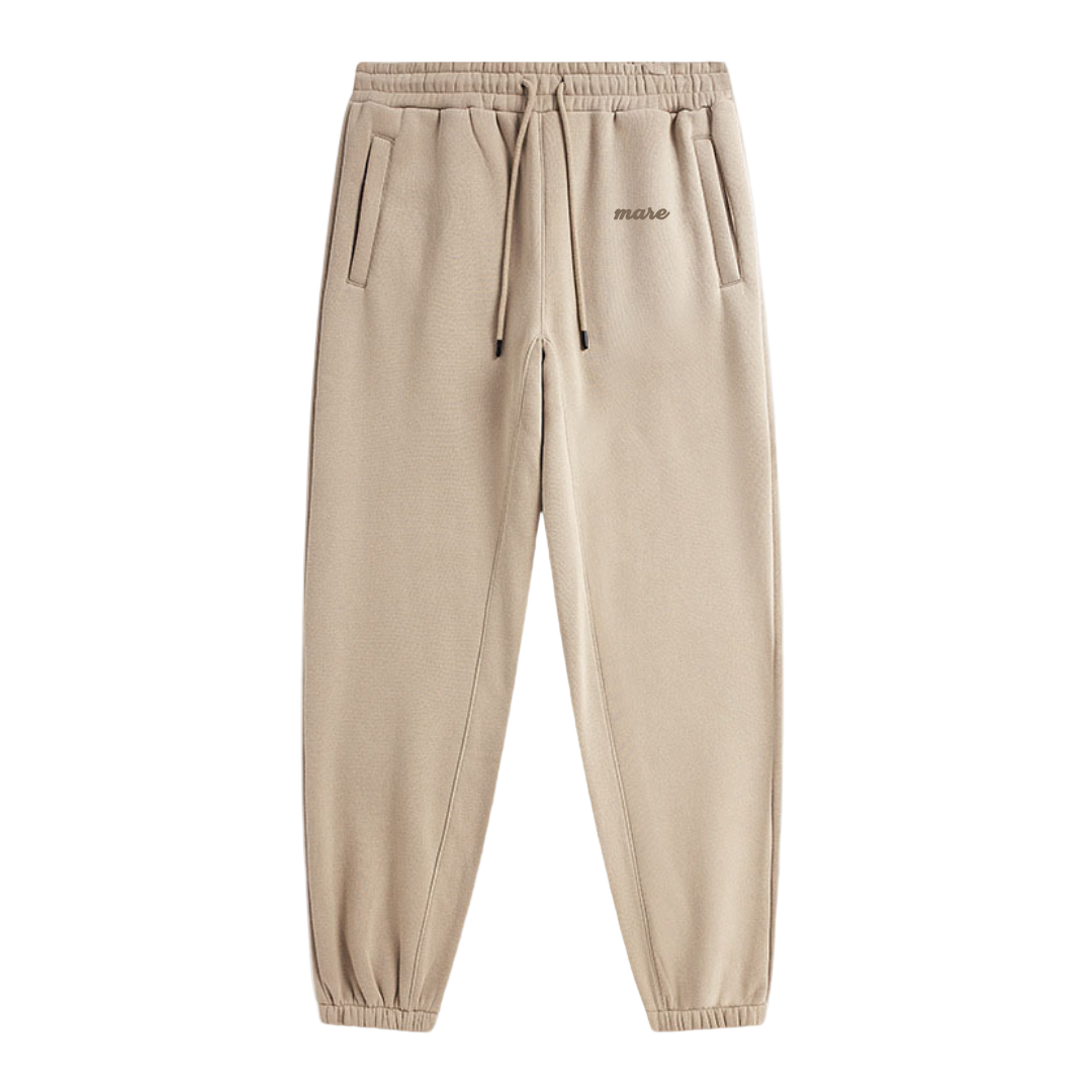 Beige sweatpants with a brand logo on a white background