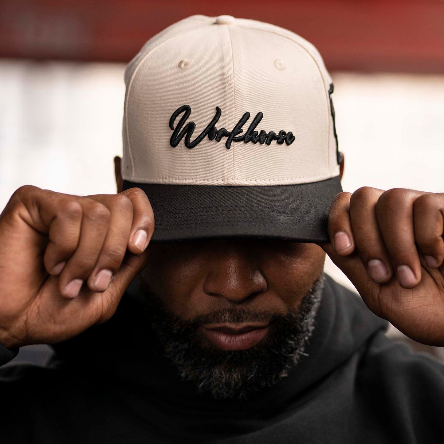 Model wearing Workhorse Legacy Hat with Lifestyle Workhorse Logo.