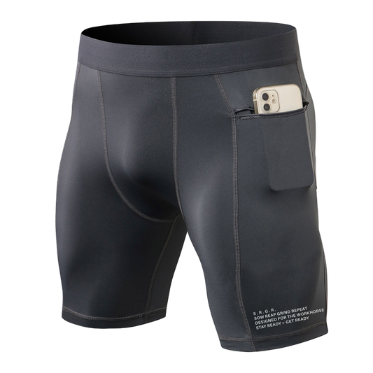 Dark gray athletic shorts with a pocket holding a phone on a white background