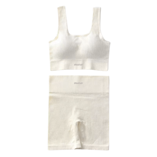 White ribbed tank top and shorts set on a white background