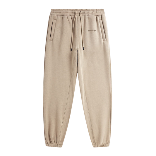 Beige sweatpants with a brand logo on a white background