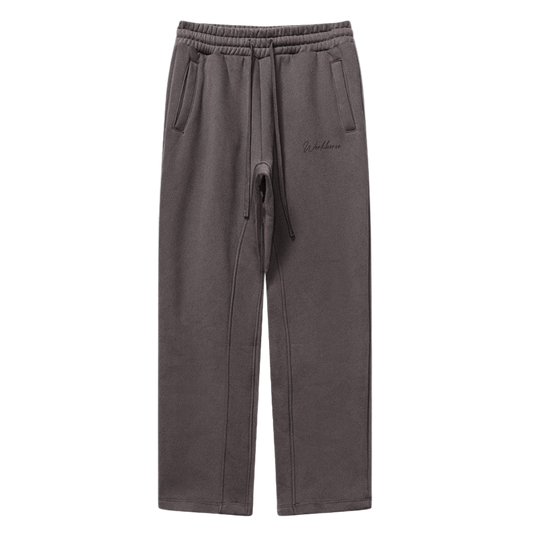 Plum sweatpants with a drawstring on a white background